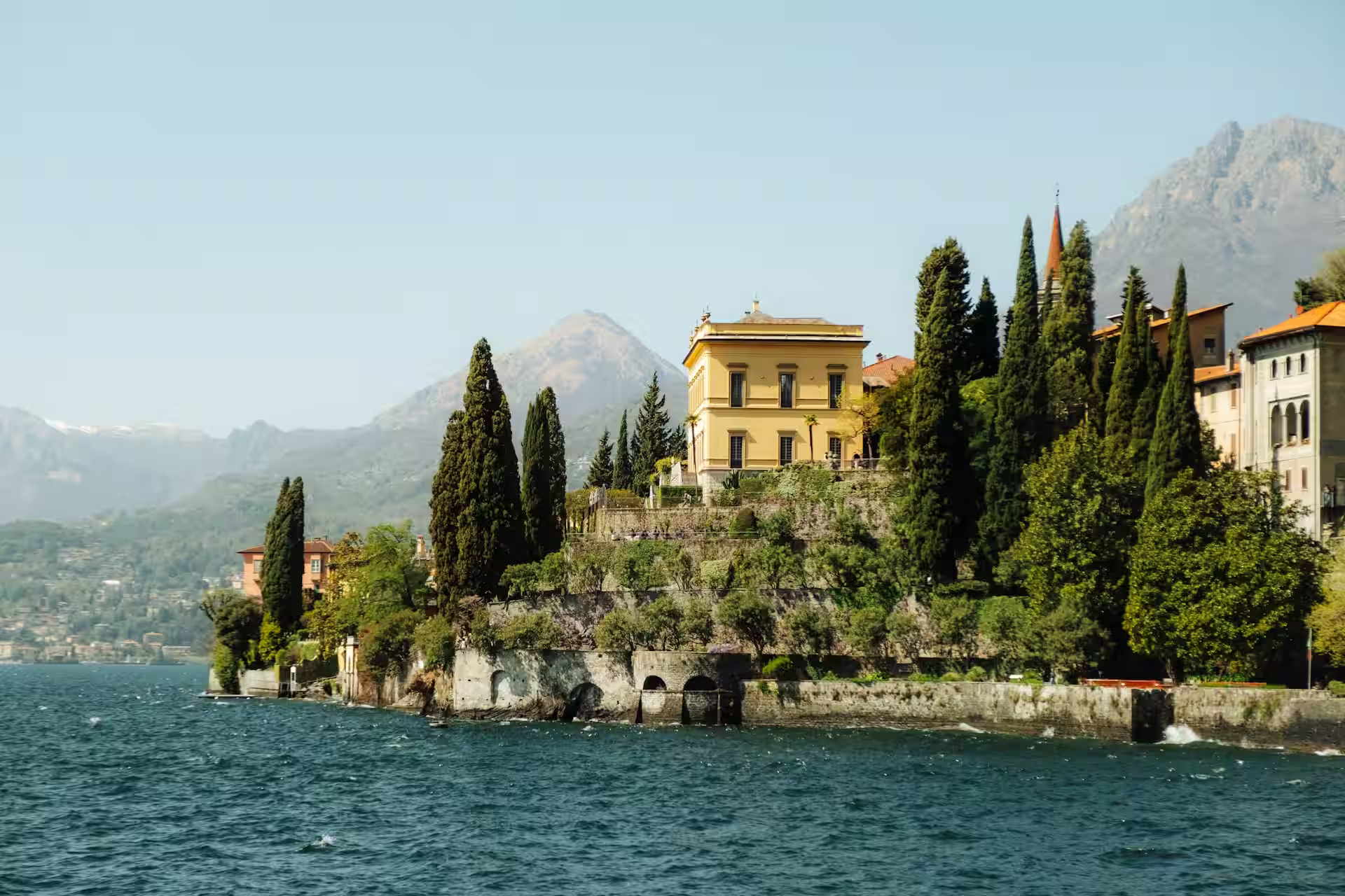 Historic neoclassical villas and cypress gardens framing the crystalline waters of Lake Como.